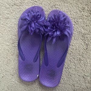Purple feather flip flops